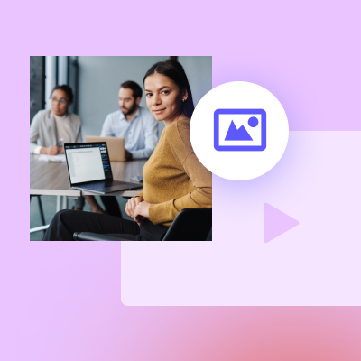 A professional woman in a meeting room with colleagues in the background, using Biteable video maker.